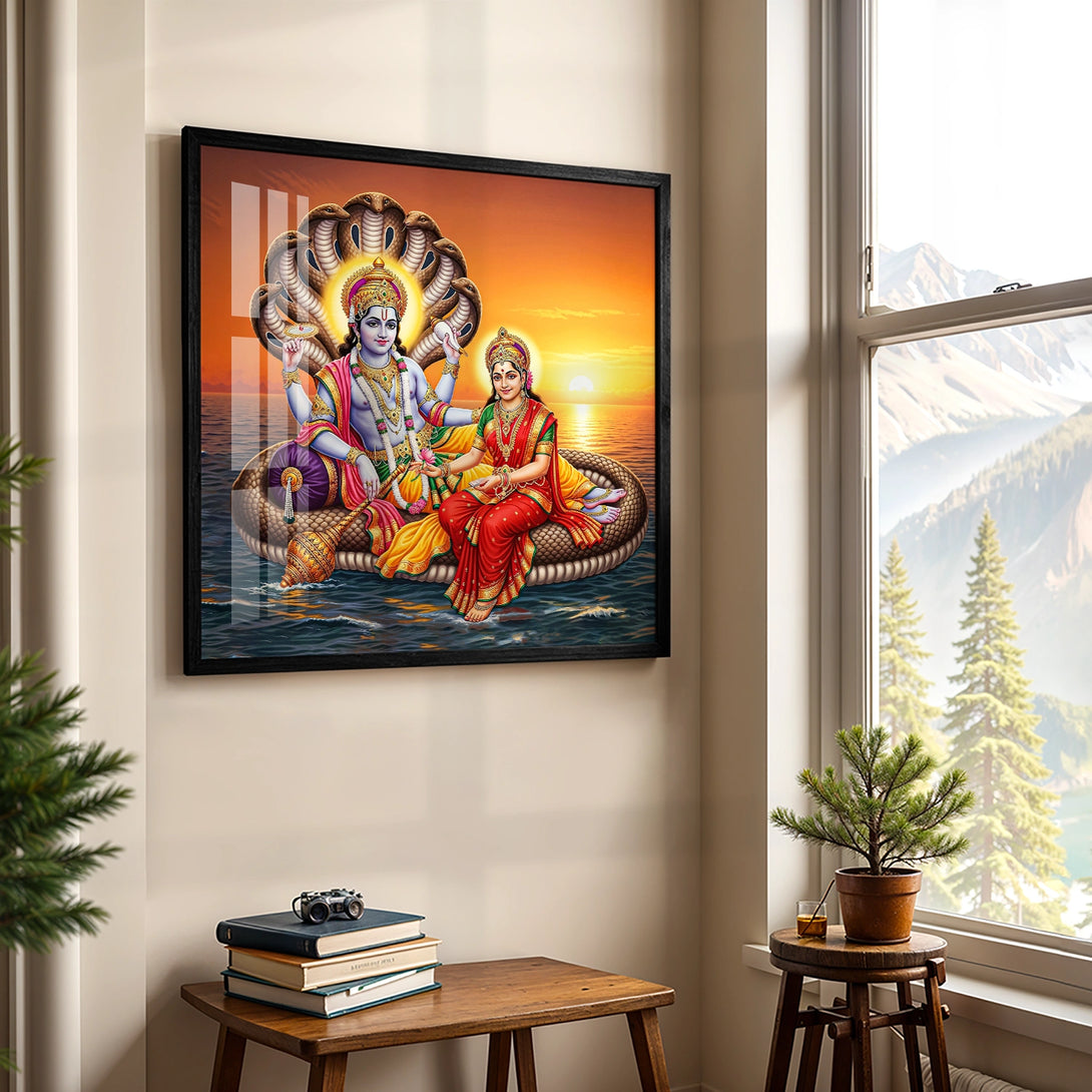 Black framed spiritual artwork of Vishnu and Lakshmi in traditional attire
